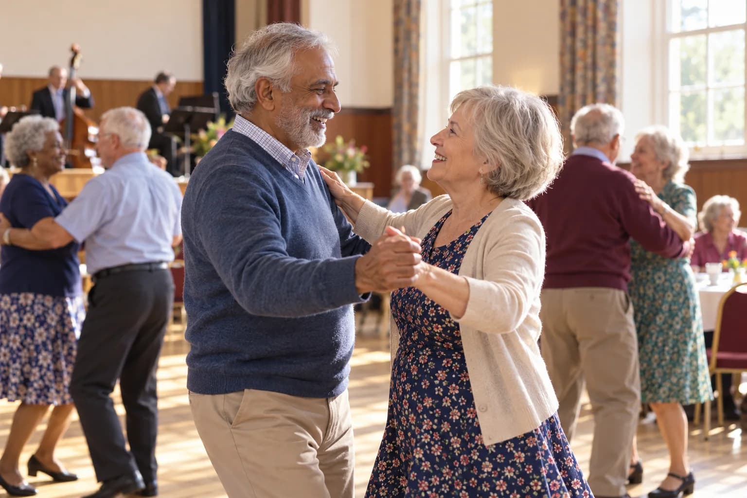 An older couple dancing at a tea dance